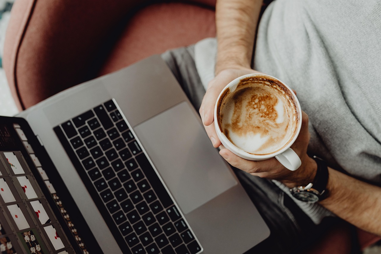 Coffee, cup, computer — Pest Control Company Specialized in Seasonal Pest Management and Prevention