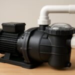 A close-up view of a pool pump with visible pipes and motor, set against a neutral background.